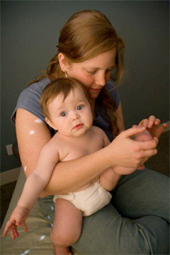 Acupuncturist Jasmine Bay doing acupuncture with a toddler